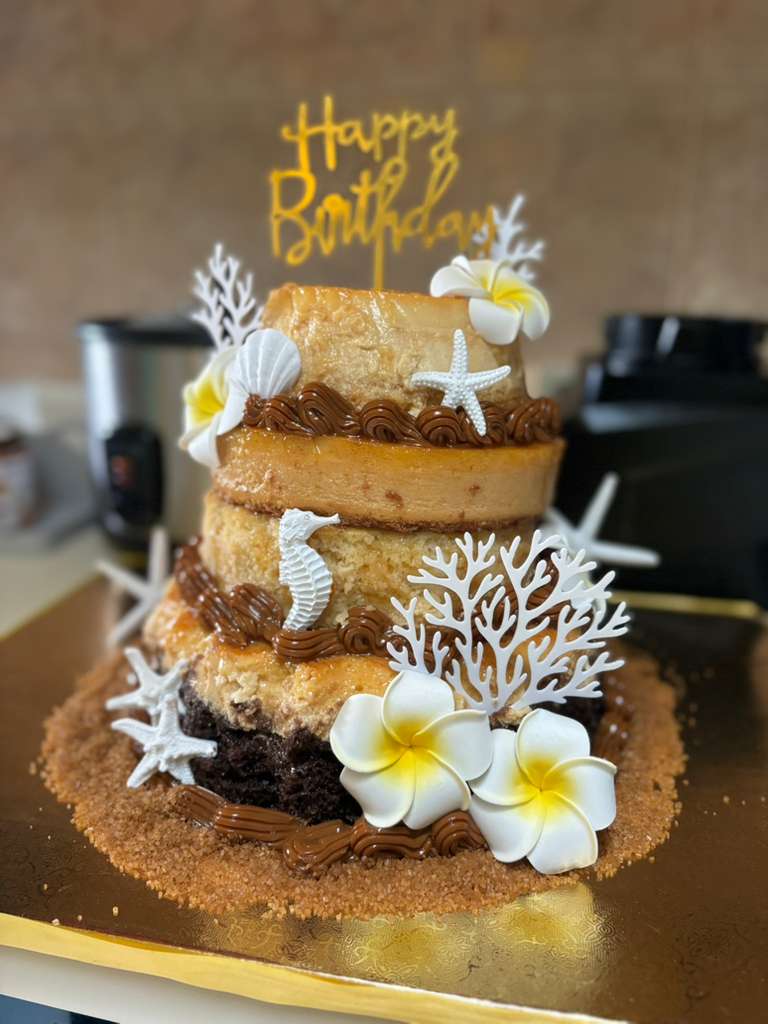 Three-level birthday chocoflan with beach decorations